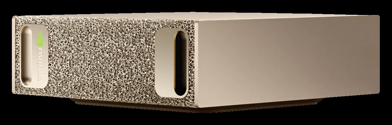 An NVIDIA DGX Spark: a small gold desktop box